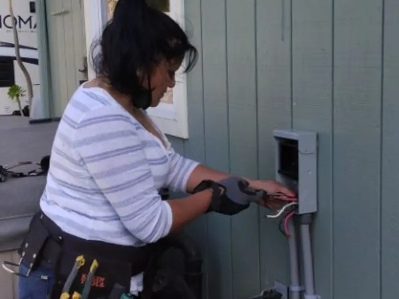 Licensed electrician wiring an exterior subpanel in Sauk Centre