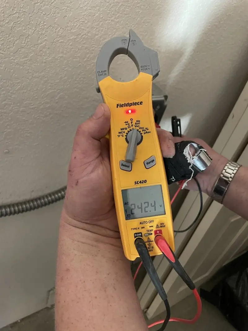 Voltage testing with clamp meter during Electrical Installation Services in Sauk Centre